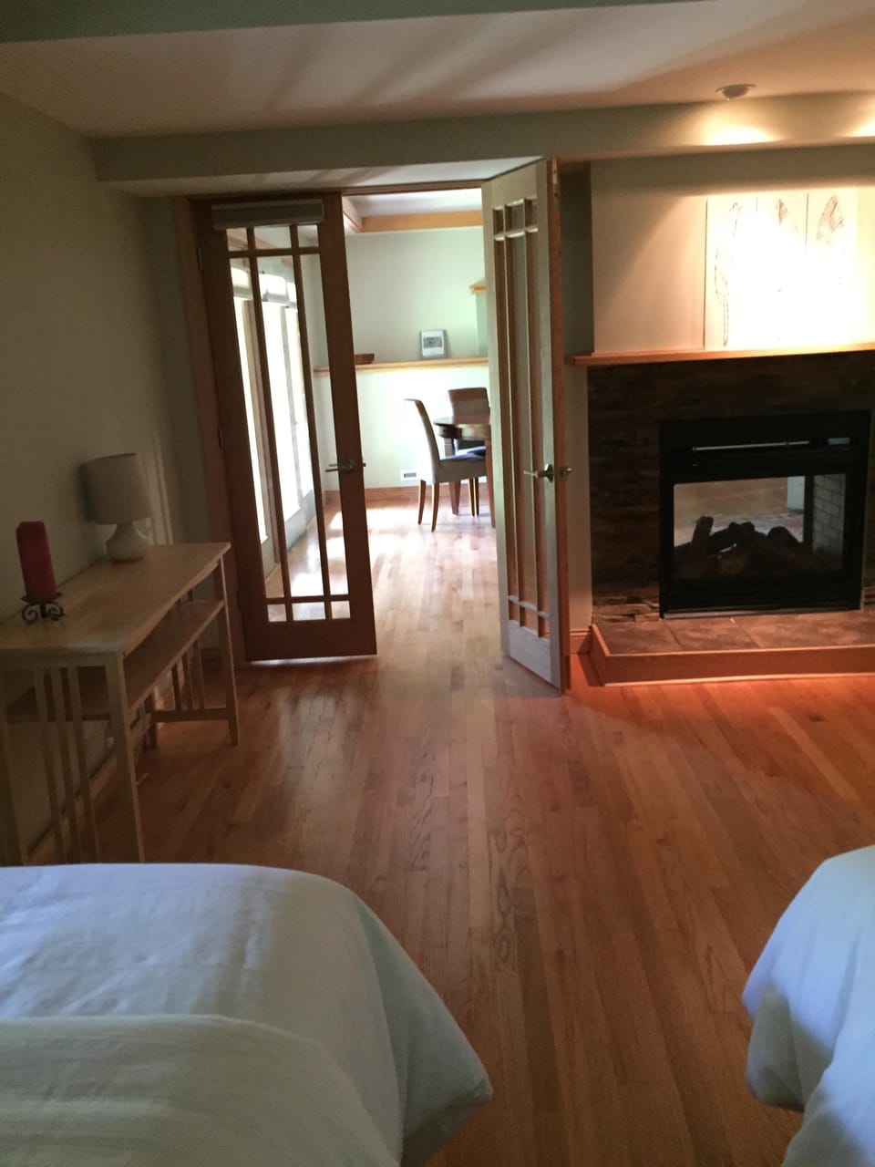 downstairs - fifth bedroom - two twin beds and two-sided fireplace. 