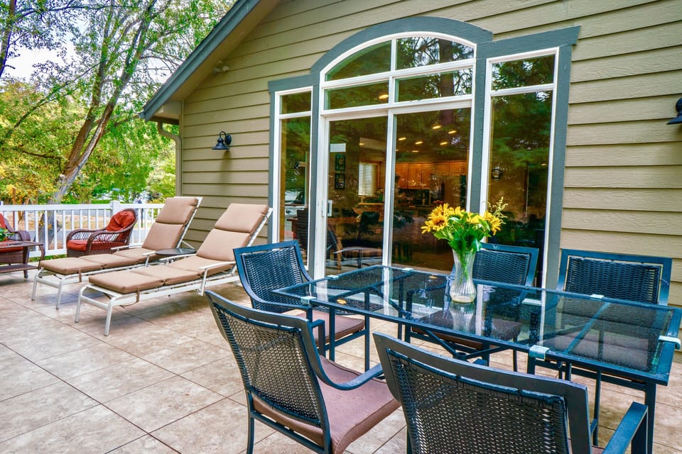 Outdoor Living with tile floor,loungers, dining 