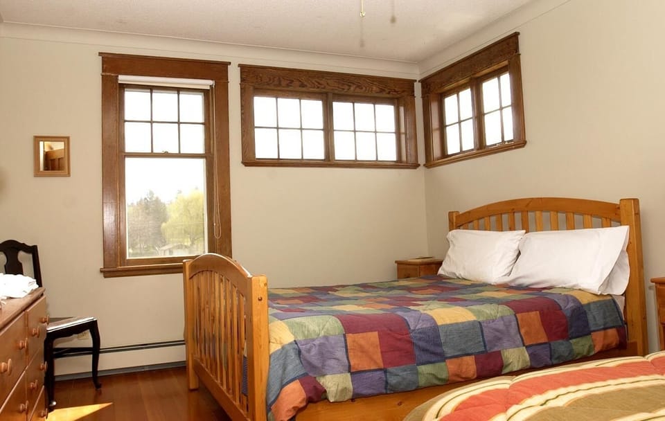 bedroom number two has queen and single beds