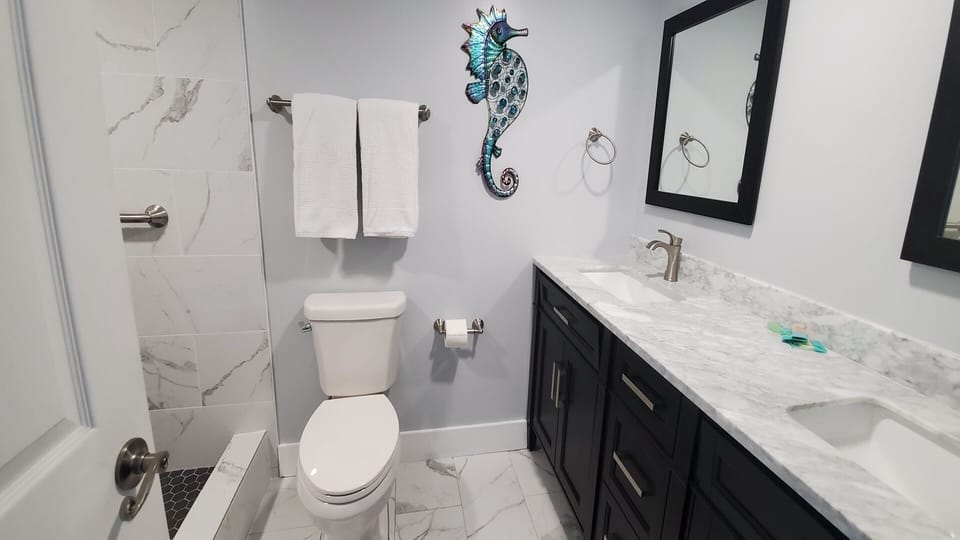 new large bathroom with double sinks and walk in shower
