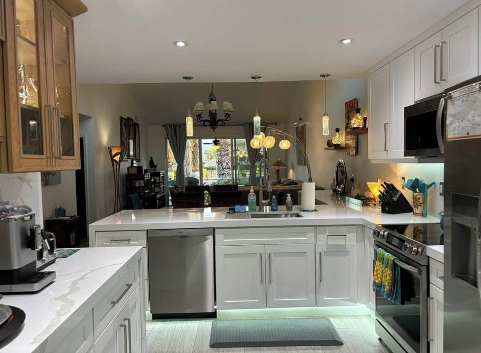 Remodeled kitchen with pool view from the kitchen sink