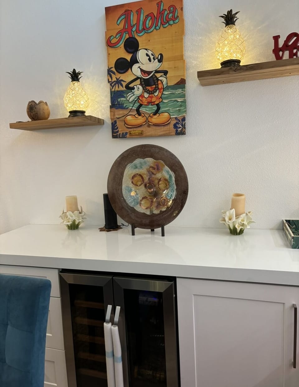 Custom quartz cabinet in dining area and locking mini bar