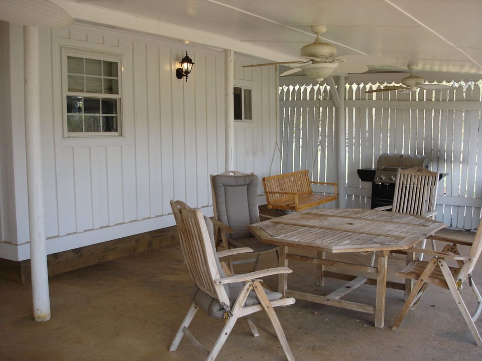 Porch Swing & Gas Grill on Patio