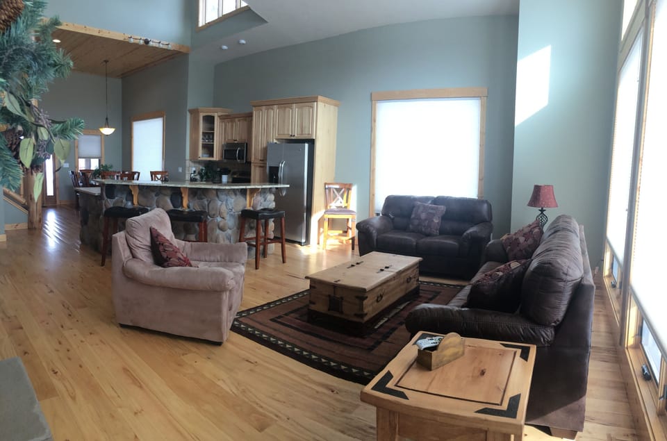 Great room, kitchen island with new barstools.