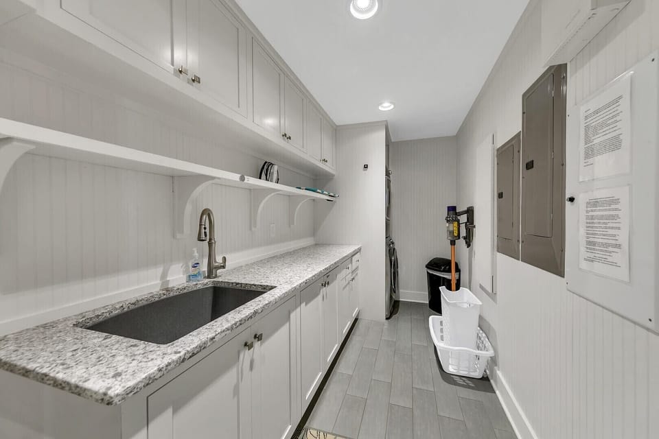 Large laundry room with washer and dryer.  