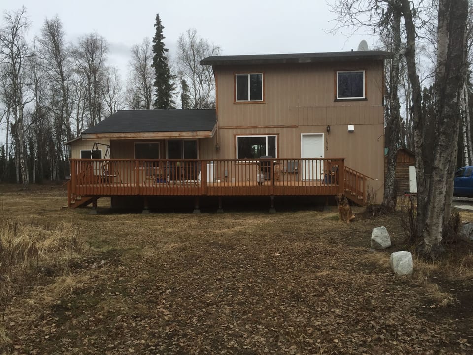 Front of house,  completed deck, grill, freezer, swing, table/chairs. Autumn 🍂