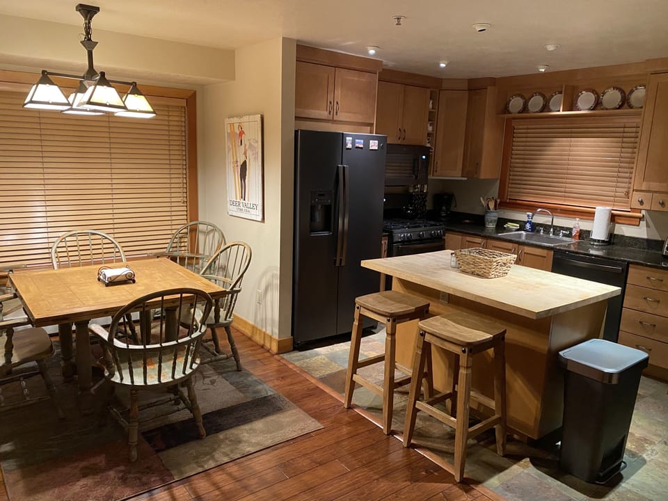 Kitchen with all black stainless steel appliances.