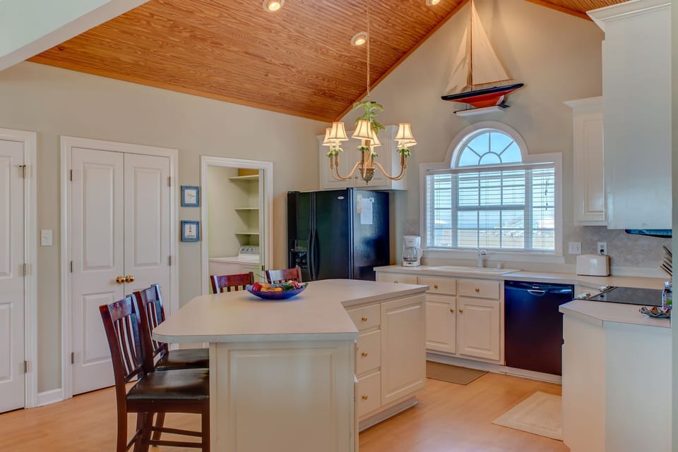 Your spacious kitchen features vaulted wood ceilings, marble countertops, and a breakfast island where you'll love preparing meals.