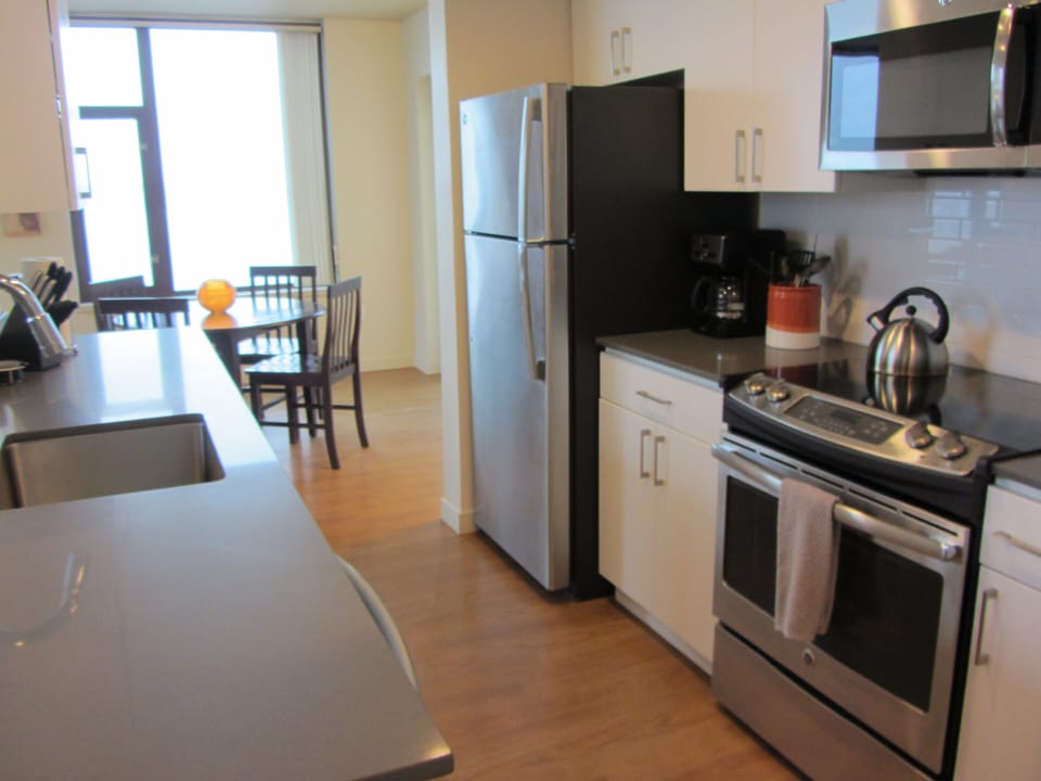 Gorgeous kitchen w/ quartz counter tops & stainless appliances