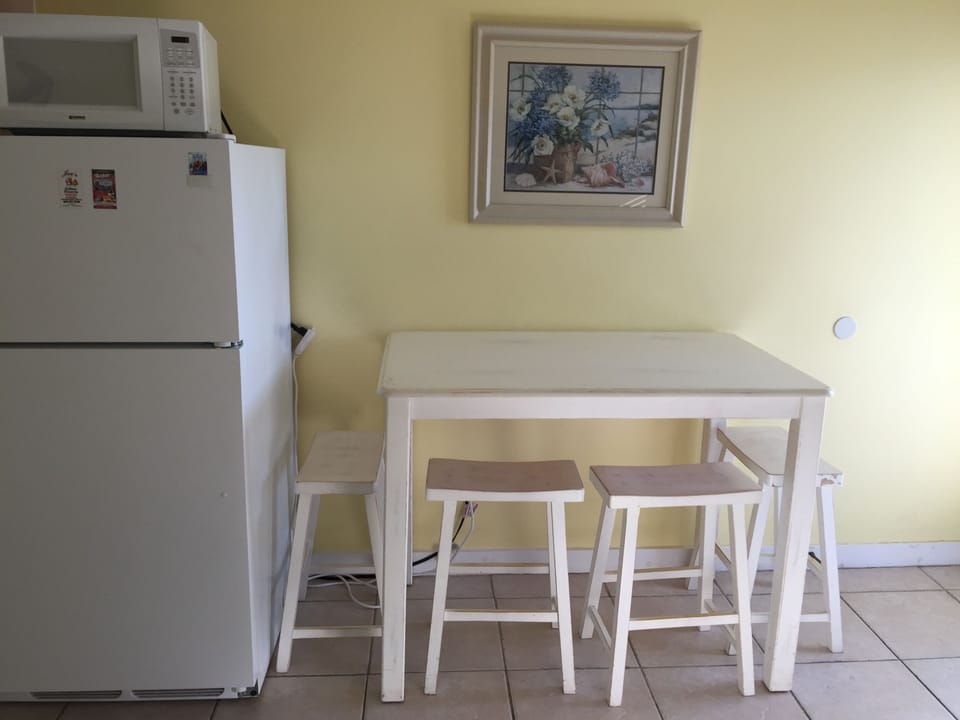 Seating for dinner in the condo and a beautiful patio without door seating.