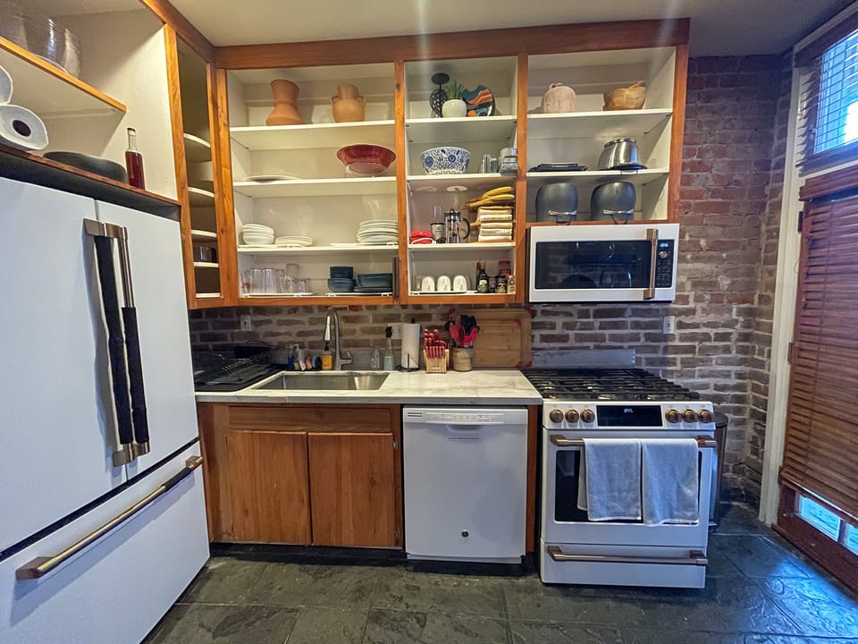 Cook in style with our fully equipped kitchen featuring modern appliances.