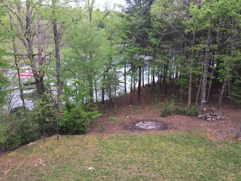 View of lake from main level deck - partially obscured by trees