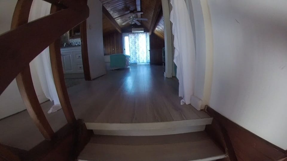 Looking at the loft bedroom from the top of the stairs