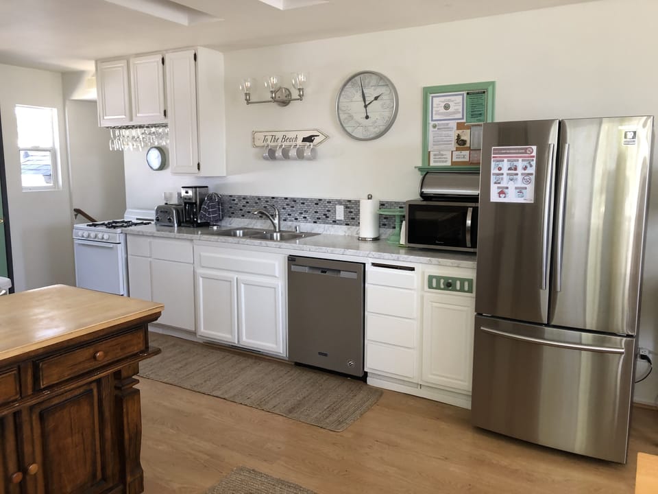 The spacious kitchen features stainless steel appliances.
