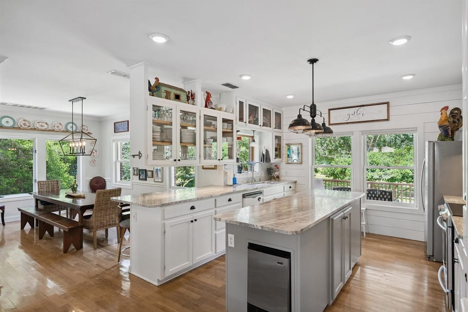 Light, airy kitchen open to Great Room with dishes enough for a crowd.