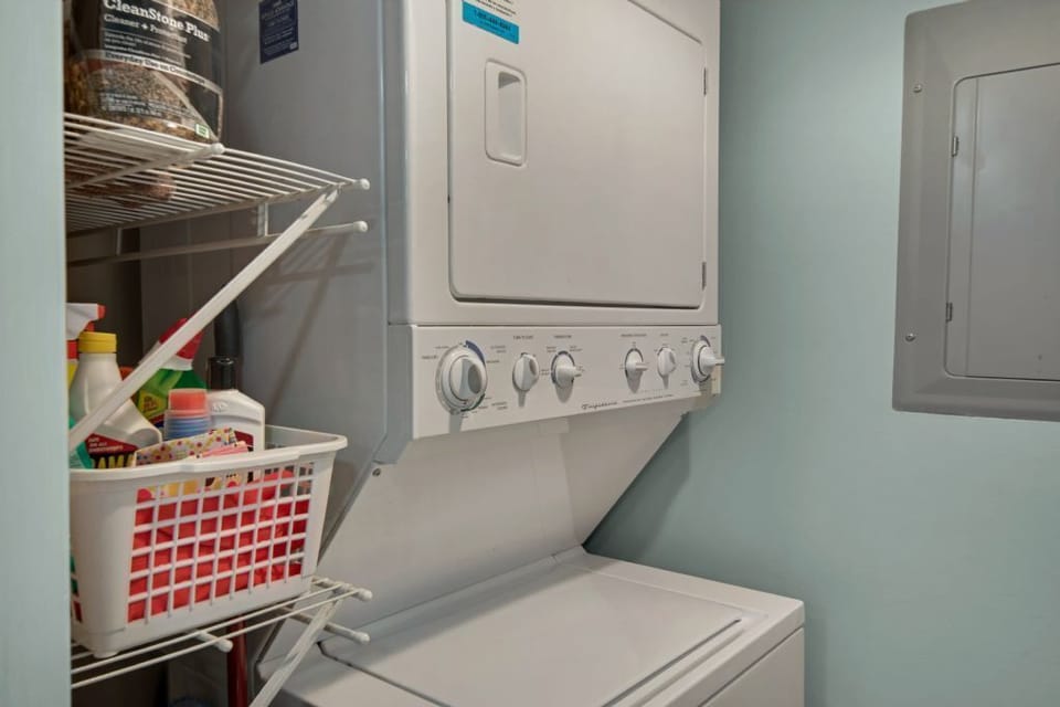 Laundry area with stack washer and dryer