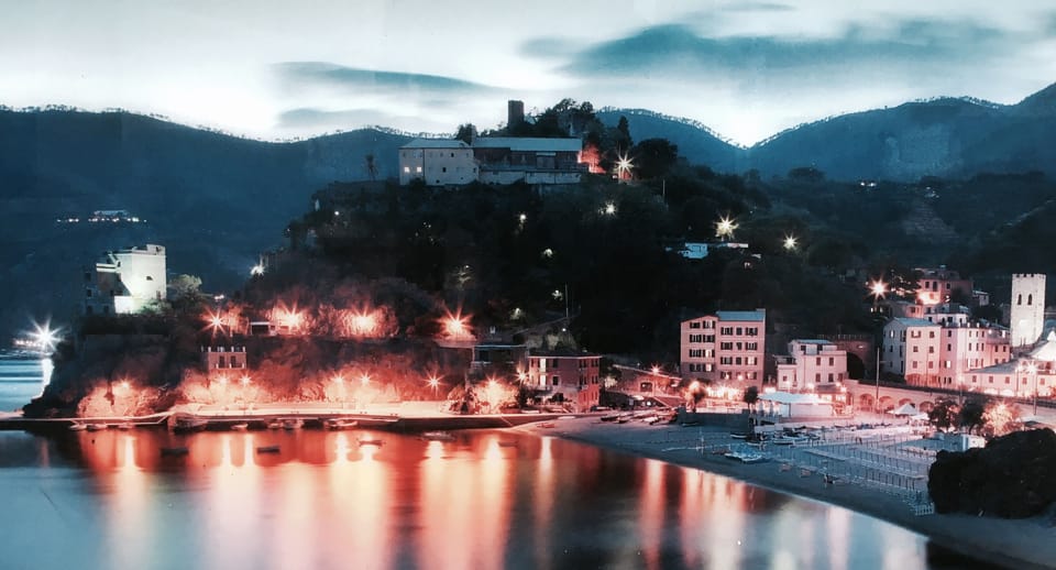 The pier with our house at sunset and, on the top of the hill, the Monastery