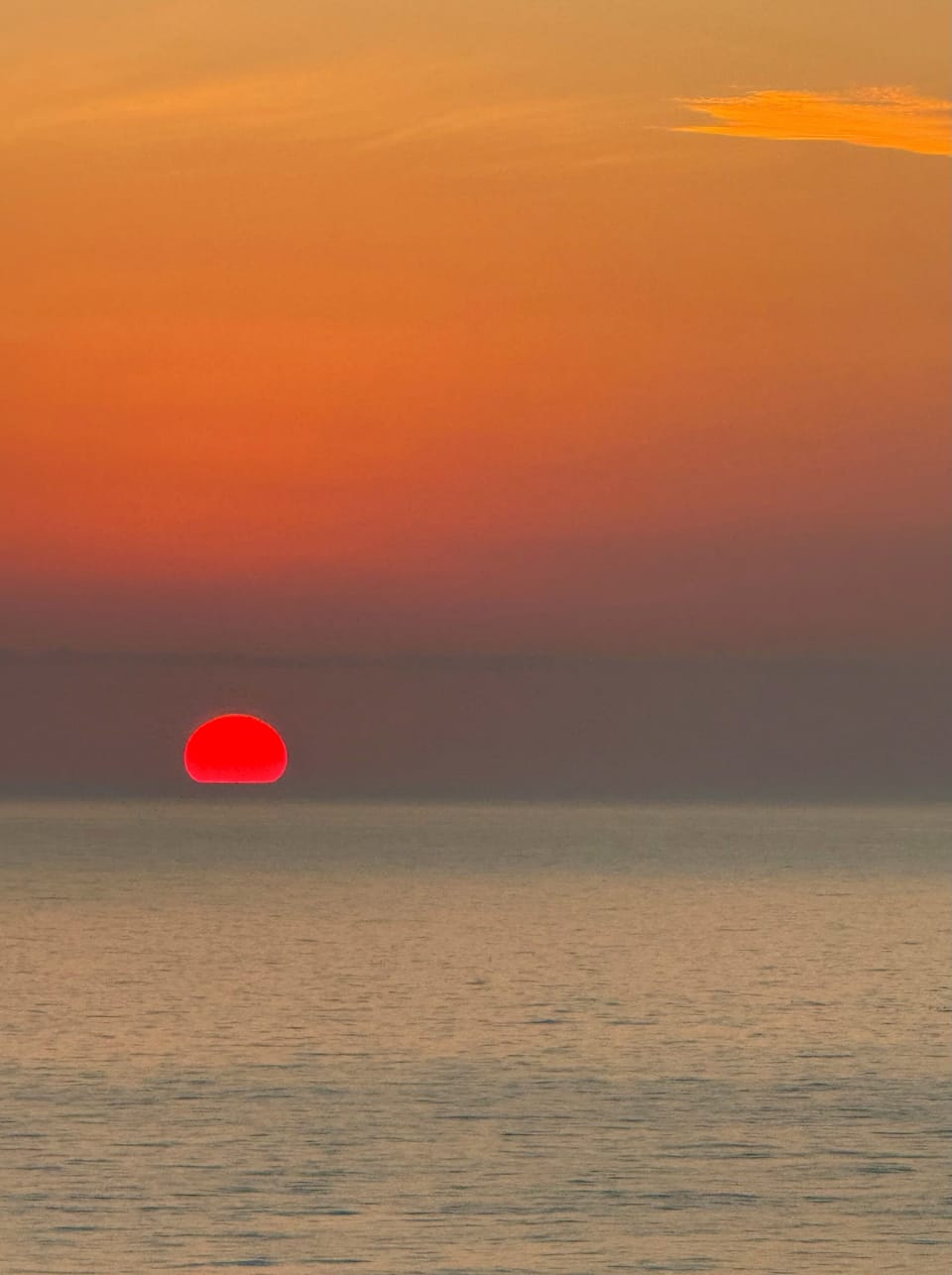 Spectacular sunsets and brilliant colored skies seen over the ocean from balcony