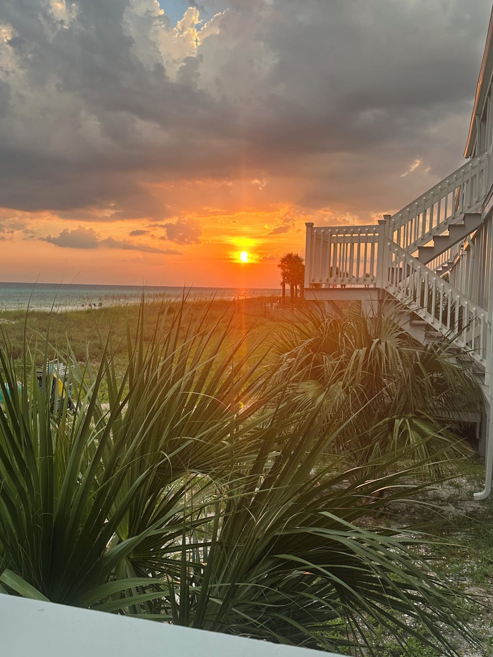 The beautiful white sand beach and ocean are just steps away from this condo