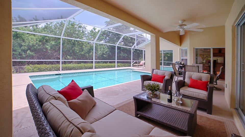 Relax and enjoy the outdoors beside the heated pool! Very private setting.