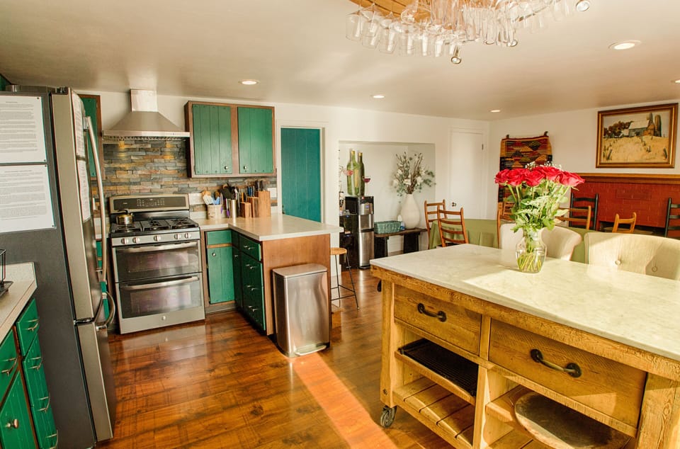 Kitchen with hot/cold water cooler and wine fridge