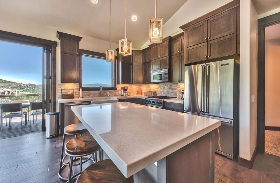 Kitchen has a center island and Viking appliances