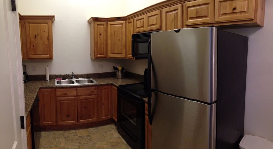 full kitchen well stocked with all appliances