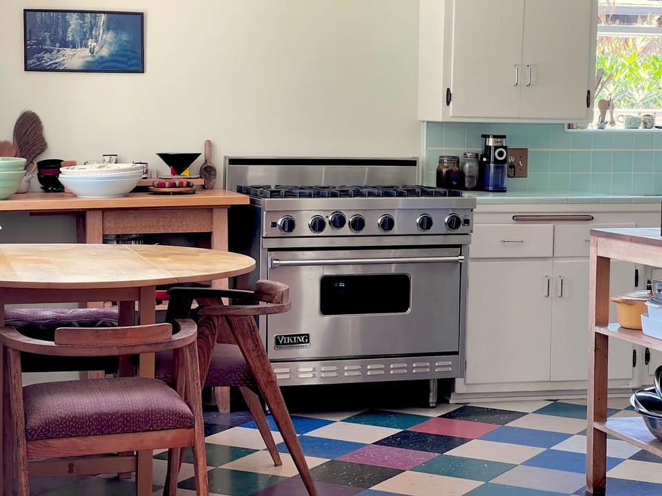 Kitchen with breakfast nook and Viking range and oven