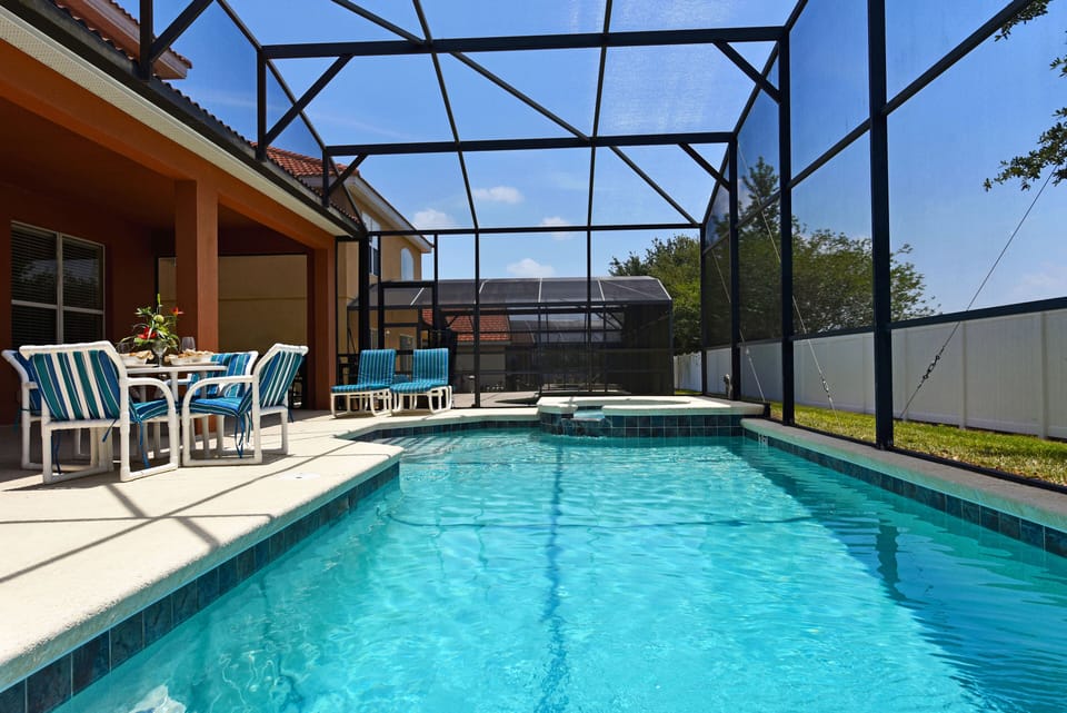 Private south-facing pool/Spa with covered lanai and child safety fence