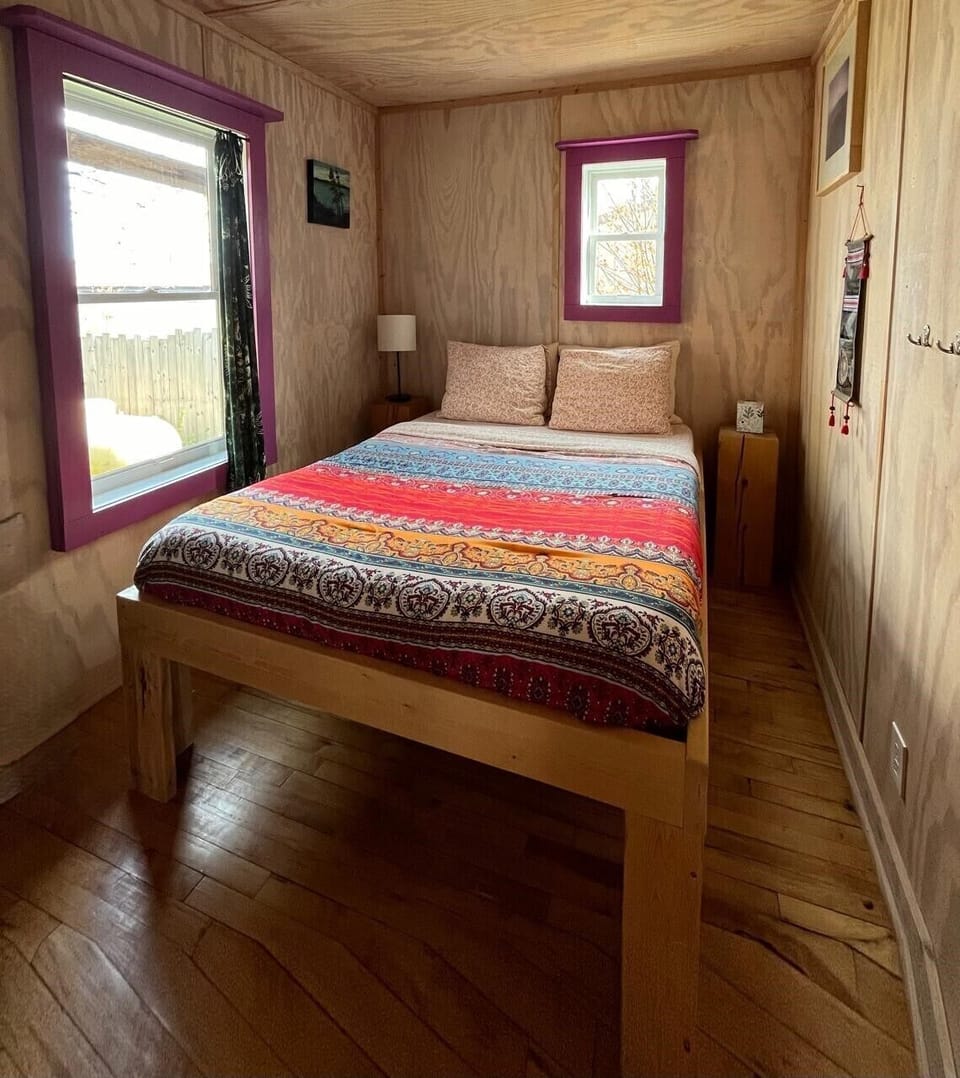 Bedroom: full size bed, drawers, hooks, shelves