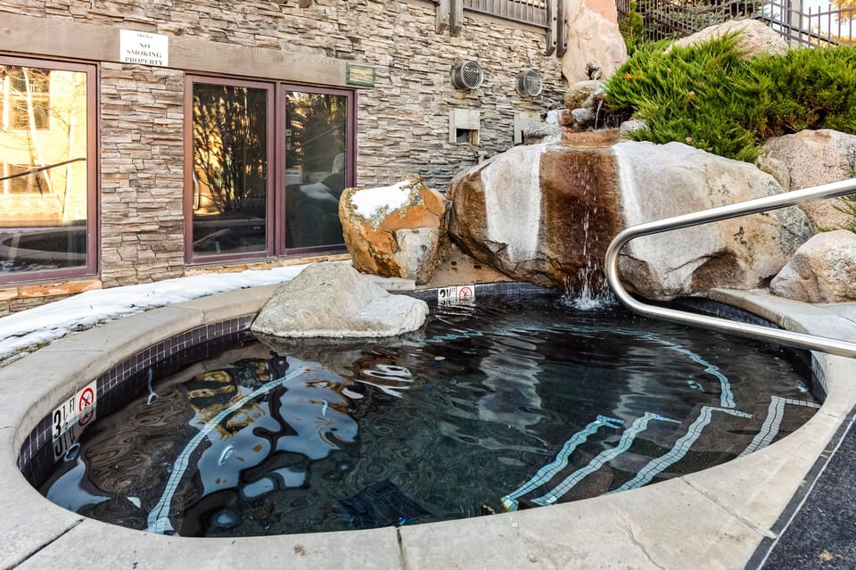 Grotto style hot tub.  This is the upper hot tub.  Work out room and Sauna too.