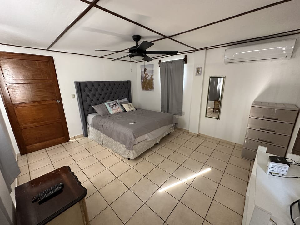 2nd largest room with Queen Bed, Full Bathroom, AC, private balcony & TV