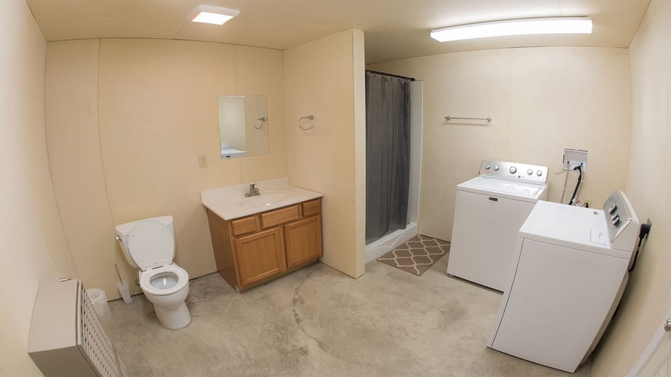 downstairs bathroom with laundry and 6 foot shower