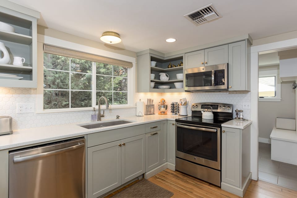Fully stocked kitchen with all appliances and cooking equipment