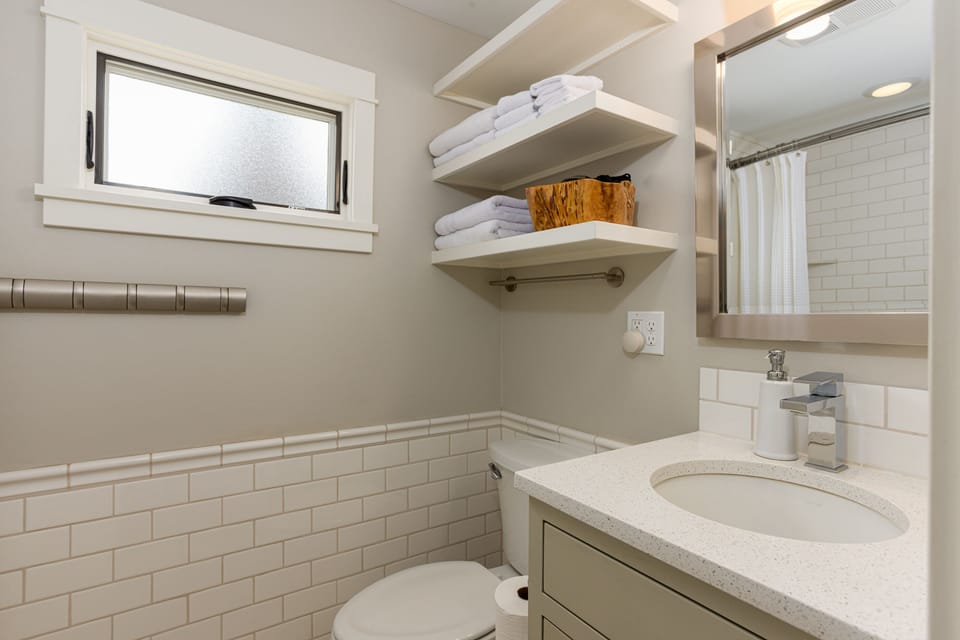 Hair dryer, plush towels, shampoo, and local Bend Soap Company bar soap provided