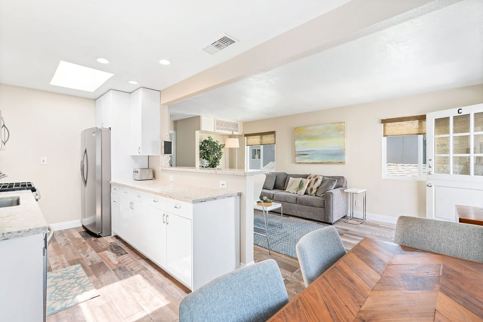 The open floor plan allows for easy, breezy hangouts. The dining table seats 4-6.
                