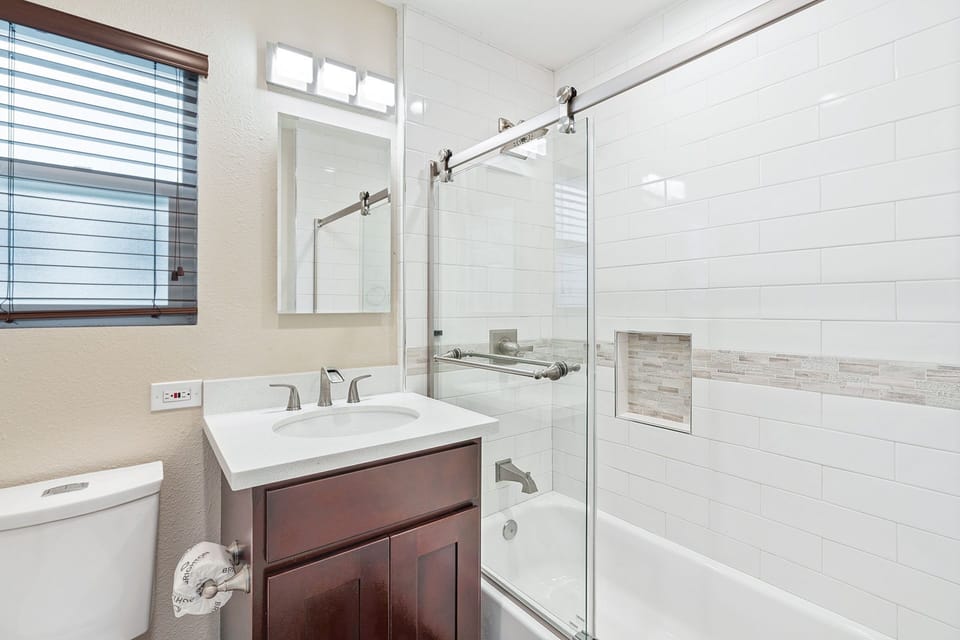 The first bathroom is located off of the hallway and has a tub/shower combo.
                
