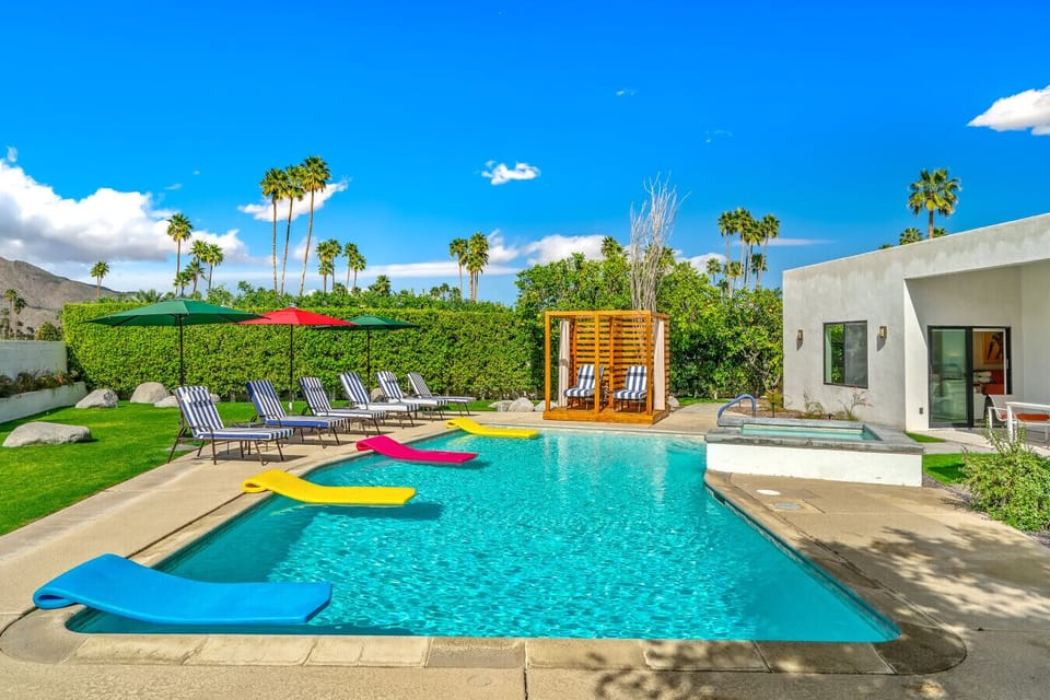 Private desert resort pool with cabanas and San Jacinto Mountains backdrop