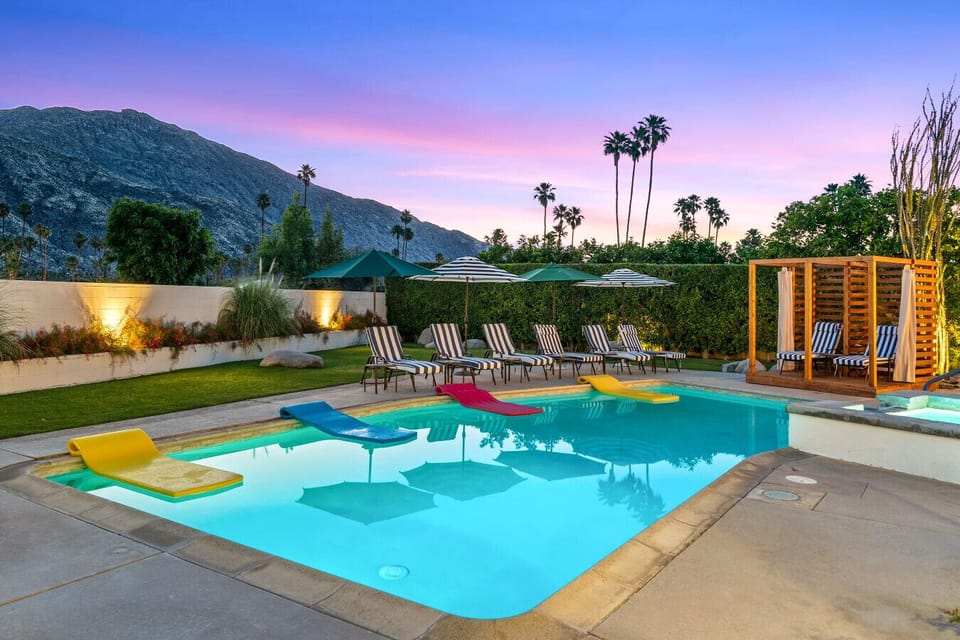Evening pool and spa with mountain reflections and soft desert twilight