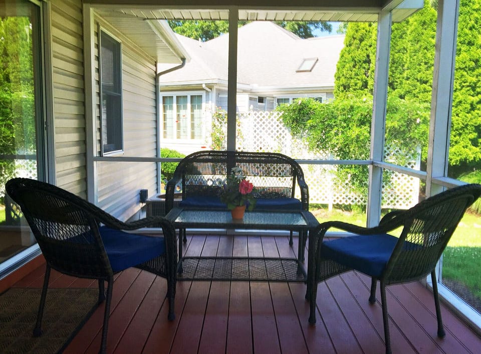 Back porch includes sitting area for 4; beautiful golf course views a bonus.