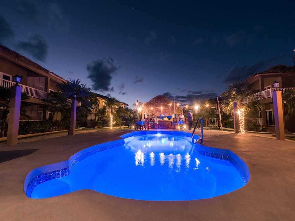 One of the three pools lit up at night