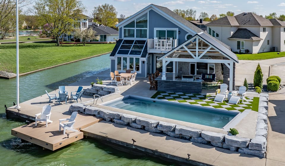 Private oasis with pool, covered outdoor kitchen, fireplace, firepit.