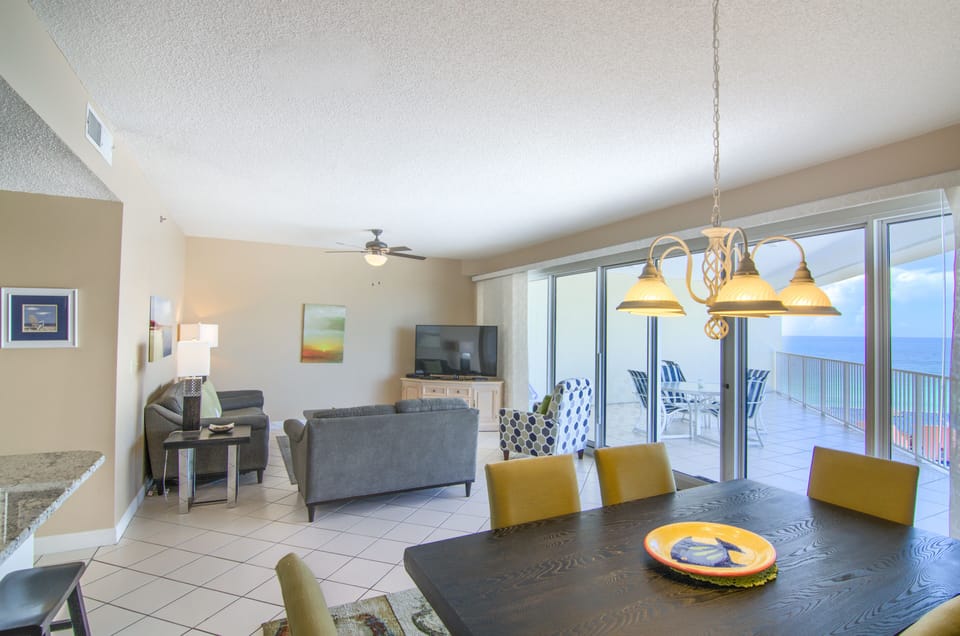 Dinning room living room and balcony with view