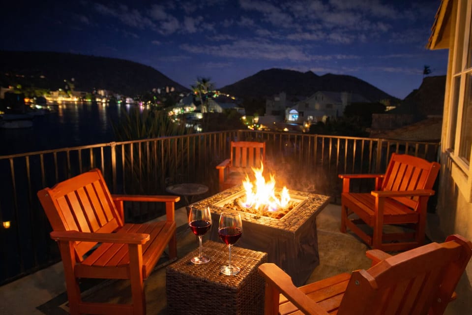 Unwind with a glass of wine around the soft glow of the balcony firepit