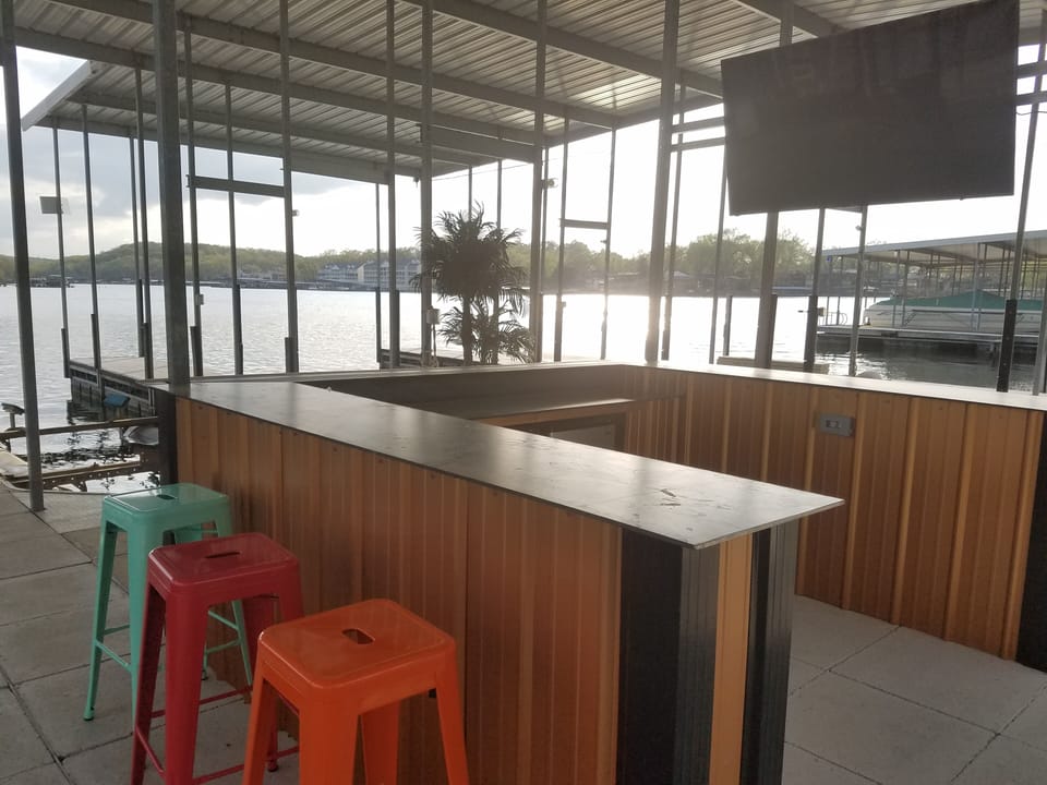 Custom bar on dock.  2 fridges and a 65 inch HDTV.