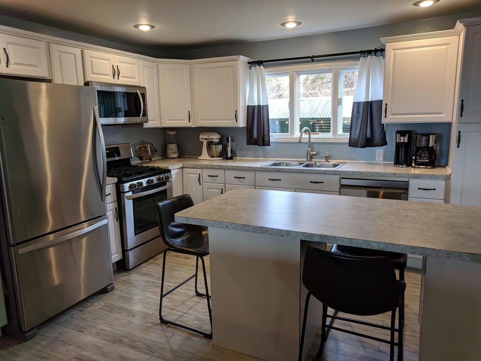 View of kitchen from living room, bright and airy!