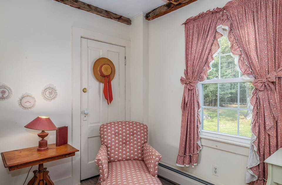 Country room with 2 Twin beds and a chaise lounge for reading buffs.