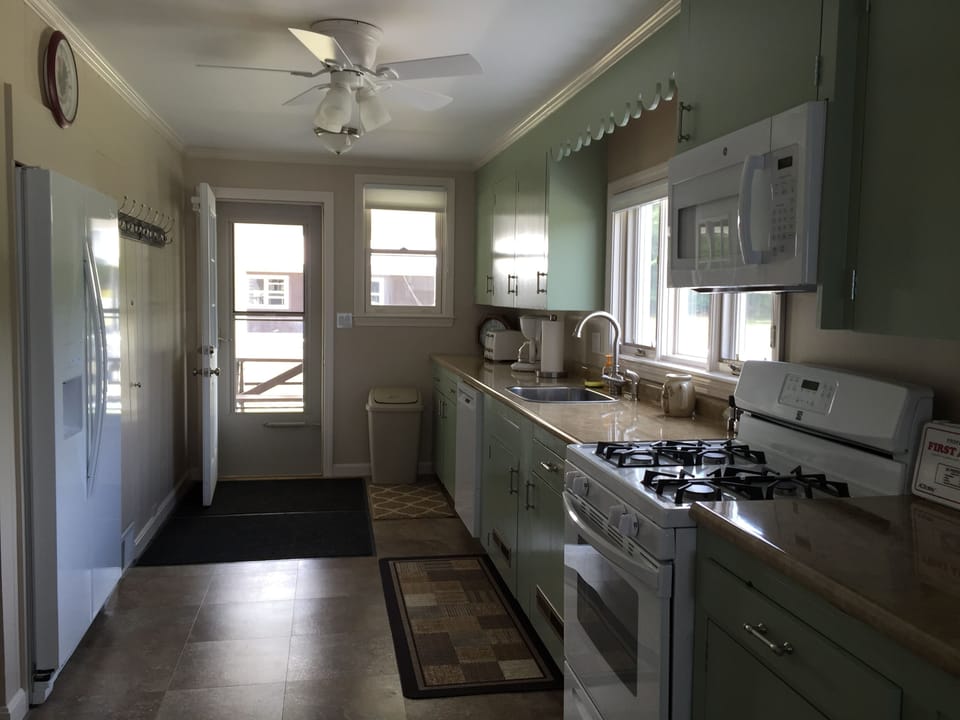 bright kitchen with all new appliances and door to back poarch