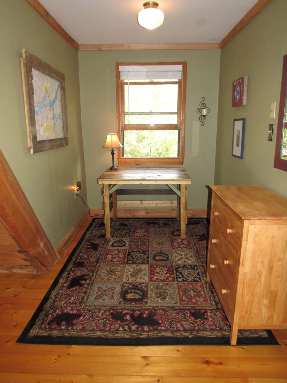 Alcove in master bedroom with desk and dresser