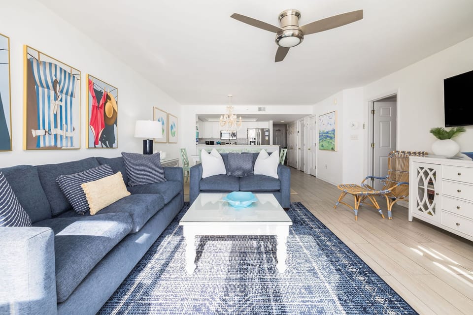 Stylish furnishings, coastal colors, and a welcoming space to relax after a day at the beach